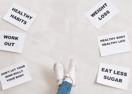 Inspirational health and fitness messages with shoe-clad feet, promoting healthy habits and wellbeing.